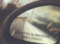 Objects in Mirror Are Losing Car Sticker