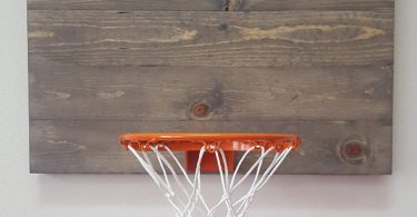 Weathered Grey Wood Basketball Hoop With Orange Rim