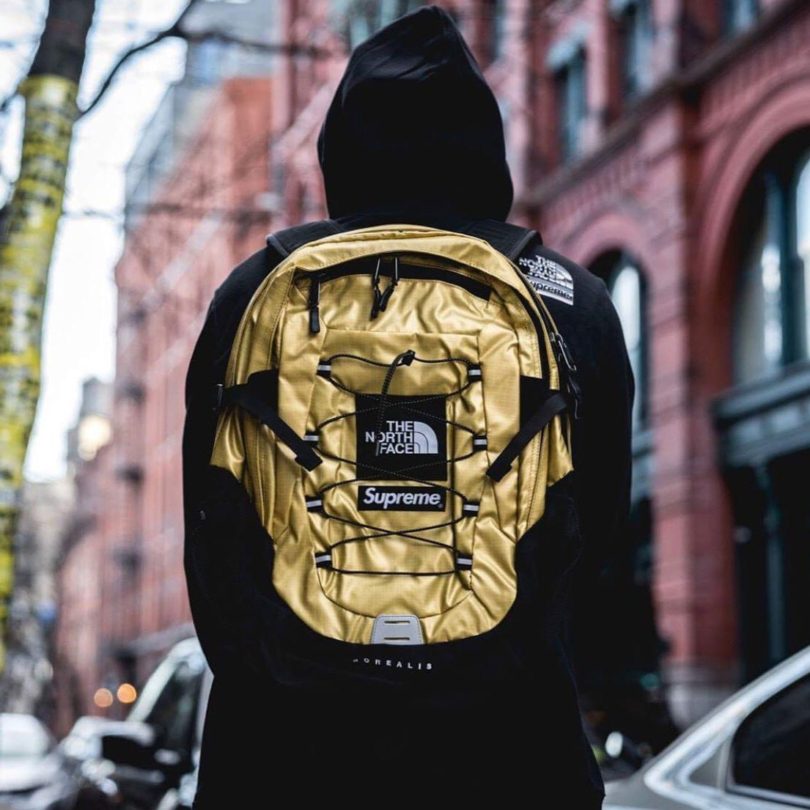 gold supreme north face backpack