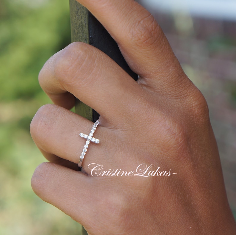 Celebrity Style Sideways Cross Ring With Clear CZ Stones