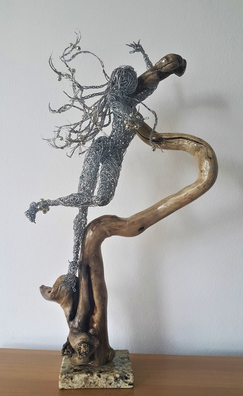 Snake Dancer wire sculpture Charming the Serpent Lady and
