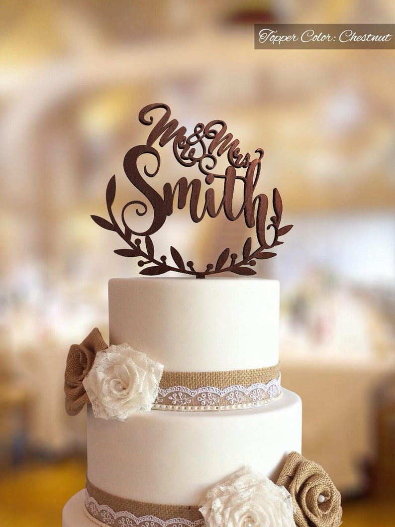 Wedding cake topper with personalized surname.  Personalized