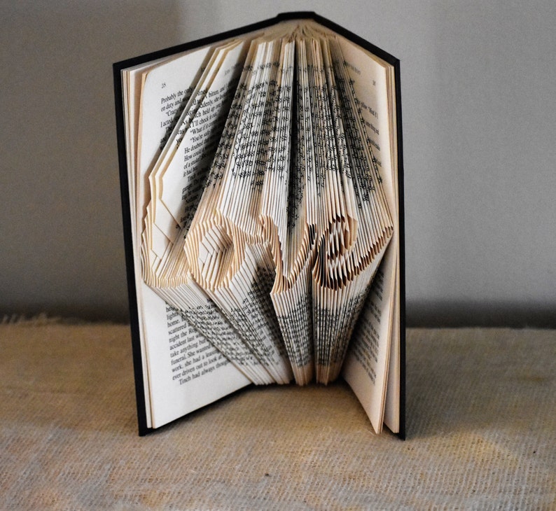 Folded Book Art Pattern Featuring the Word Love