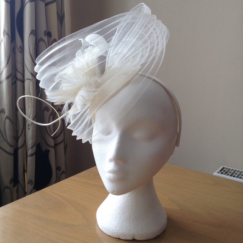 Ivory Cream Fascinator Hatinator with a wave of pleated crin