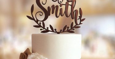 Wedding cake topper with personalized surname.  Personalized