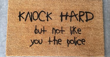 Knock hard but not like you the police welcome mat funny