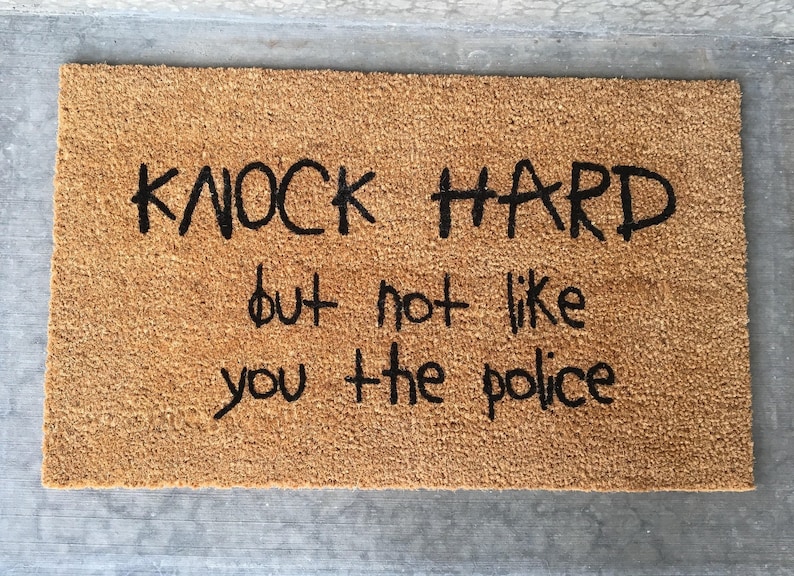 Knock hard but not like you the police welcome mat funny