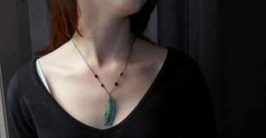 Green feather grey and garnets pendant