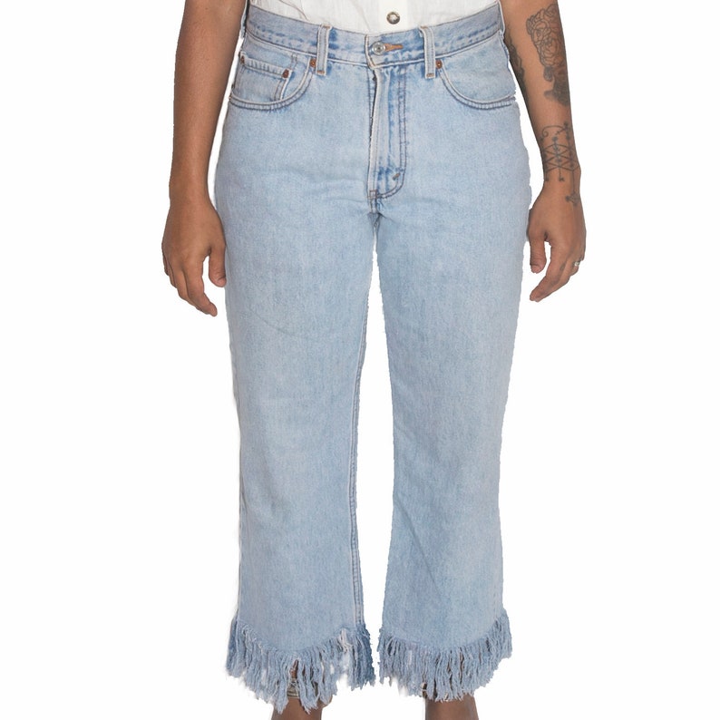 Upcycled fringed hem jeans